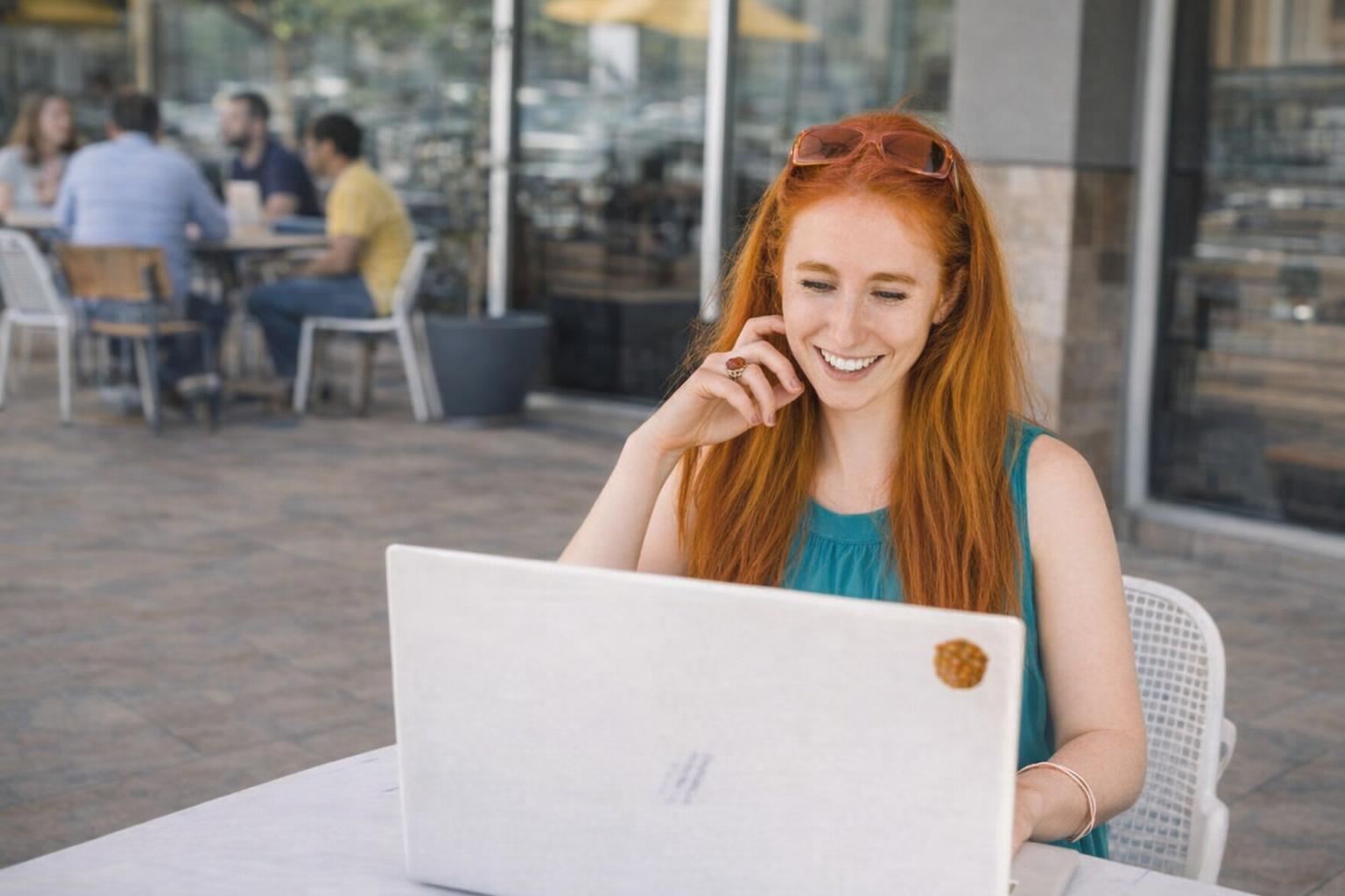 Instructor guiding students on optimizing digital courses in a modern classroom.